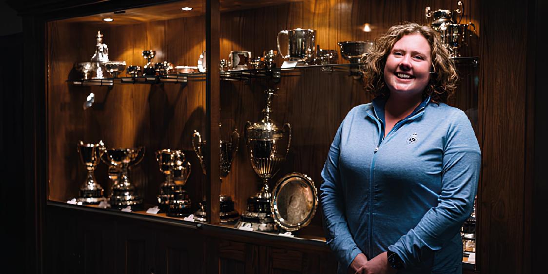 Charlene Reid with the trophy cabinet at Royal Portrush