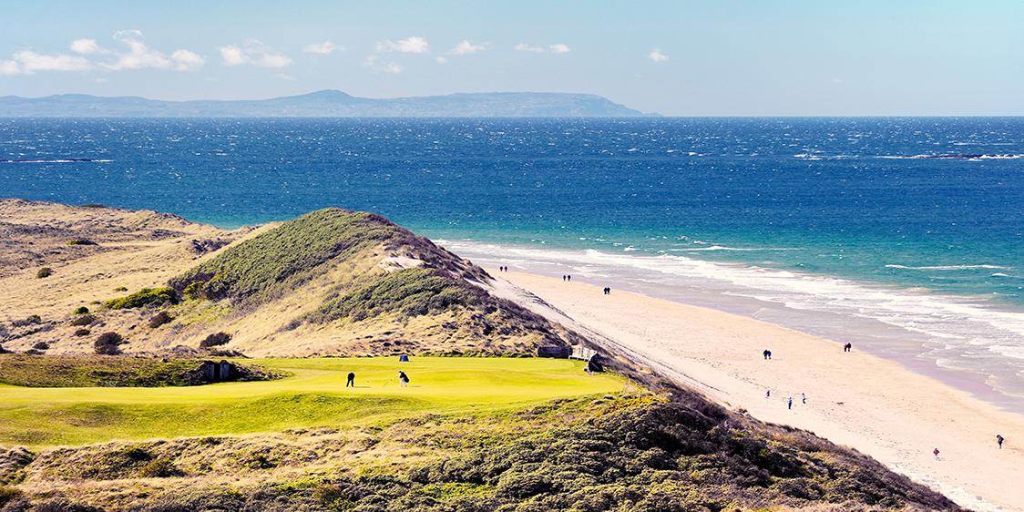 Royal Portrush Golf Club, Northern Ireland UK. The 5th hole of the Dunluce Links championship course above the White Rocks beach