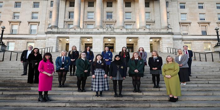 Girls standing in front of Stormont Buildings